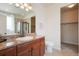 Bathroom with a granite countertop, wooden cabinets, a toilet, and a shower stall with a glass door at 5584 Turnbury Cir, Elizabeth, CO 80107