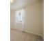 This bedroom features carpeted floors, bare walls, and a window with white curtains that provide natural light at 5584 Turnbury Cir, Elizabeth, CO 80107