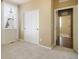 This bedroom features carpeted floors, a window with white curtains, and a closet with sliding doors at 5584 Turnbury Cir, Elizabeth, CO 80107