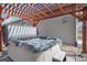Backyard hot tub under a wooden pergola, perfect for relaxation and leisure at 5584 Turnbury Cir, Elizabeth, CO 80107