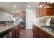 Spacious kitchen featuring granite countertops, stainless steel appliances, and stylish cabinetry at 5584 Turnbury Cir, Elizabeth, CO 80107