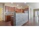 Well-equipped kitchen features granite countertops, stainless steel appliances, and center-island seating at 5584 Turnbury Cir, Elizabeth, CO 80107