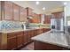 Bright kitchen with stainless steel appliances, granite countertops, and ample cabinet space at 5584 Turnbury Cir, Elizabeth, CO 80107