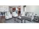 Bright living area with hardwood floors, stylish decor, and a comfortable seating arrangement at 5584 Turnbury Cir, Elizabeth, CO 80107