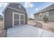 Exterior view of a backyard shed with a concrete pad, offering storage and utility space at 5584 Turnbury Cir, Elizabeth, CO 80107