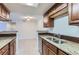 Stylish kitchen with granite countertops and stainless steel sink and appliances at 18105 E Ohio Ave # 102, Aurora, CO 80017