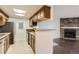 Modern kitchen featuring wooden cabinets, granite countertops, and stainless steel appliances at 18105 E Ohio Ave # 102, Aurora, CO 80017