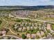 Expansive aerial view showcases the neighborhood's lush landscaping and well-maintained homes nestled in a serene setting at 4247 Thistlesage Ct, Castle Rock, CO 80109