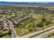 Breathtaking aerial shot of a suburban neighborhood showcasing beautiful homes and green spaces at 4247 Thistlesage Ct, Castle Rock, CO 80109