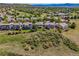 This home backs to open space and greenway, providing privacy and scenic views of lush trees and rolling green hills at 4247 Thistlesage Ct, Castle Rock, CO 80109