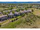 Stunning aerial view of the neighborhood highlighting lush greenery, mature trees, and meticulously kept lawns at 4247 Thistlesage Ct, Castle Rock, CO 80109