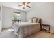Cozy bedroom featuring neutral decor, plush carpet and a window providing natural light at 4247 Thistlesage Ct, Castle Rock, CO 80109