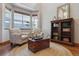 Bright living room with a bay window, hardwood floors, and a bookshelf at 4247 Thistlesage Ct, Castle Rock, CO 80109