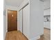 Apartment entryway with wood flooring and closet at 6930 E Girard Ave # 207, Denver, CO 80224