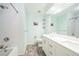 Bright bathroom featuring double sinks, white subway tile, and modern fixtures at 8150 W Calhoun Dr, Littleton, CO 80123