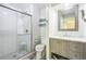 This bathroom features a glass shower and a modern vanity sink for a clean, contemporary look at 8150 W Calhoun Dr, Littleton, CO 80123