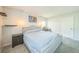 This bedroom features a queen bed, stylish end table, and decor shelves for added convenience at 8150 W Calhoun Dr, Littleton, CO 80123