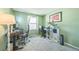 Well-lit bedroom, perfect for a home office, with a window view and neutral carpeting at 8150 W Calhoun Dr, Littleton, CO 80123
