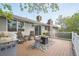 The outdoor deck features a BBQ grill and seating area for relaxed outdoor dining and entertainment at 8150 W Calhoun Dr, Littleton, CO 80123