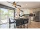 Bright kitchen with stainless appliances, granite countertops, and an island with bar seating at 8150 W Calhoun Dr, Littleton, CO 80123