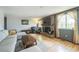 Bright living room showcasing a cozy fireplace and ample natural light at 8150 W Calhoun Dr, Littleton, CO 80123