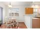 Sunny breakfast nook with wood table and views of the backyard through a large window at 326 W Jamison Pl # 51, Littleton, CO 80120