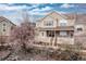 Charming multi-level home with a stone and siding facade, landscaped front yard, and inviting front porch at 326 W Jamison Pl # 51, Littleton, CO 80120