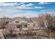 Charming multi-level townhomes with stone accents, landscaped front yards, and cozy front porches at 326 W Jamison Pl # 51, Littleton, CO 80120