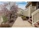 Landscaped walkway and porch with neutral siding, creating a welcoming path to the charming residence at 326 W Jamison Pl # 51, Littleton, CO 80120