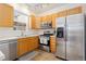 Kitchen features stainless steel appliances, including a refrigerator, oven, and dishwasher at 326 W Jamison Pl # 51, Littleton, CO 80120
