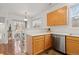 Well-lit kitchen area leads to an outdoor patio through sliding glass doors at 326 W Jamison Pl # 51, Littleton, CO 80120