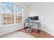 Bright office space with a large window, hardwood floors, and a modern desk setup at 326 W Jamison Pl # 51, Littleton, CO 80120