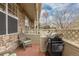 Cozy patio with stone accents, outdoor seating, and a grill, perfect for entertaining and relaxation at 326 W Jamison Pl # 51, Littleton, CO 80120