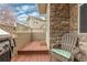 Inviting outdoor patio featuring stone details, comfortable seating, and a grill, ideal for relaxing at 326 W Jamison Pl # 51, Littleton, CO 80120