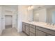 Double vanity bathroom with a walk-in shower at 2571 W 69Th Pl, Denver, CO 80221