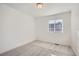 Bright bedroom featuring gray carpeting and a window with blinds at 2571 W 69Th Pl, Denver, CO 80221