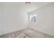 Bright bedroom featuring gray carpeting and a window with blinds at 2571 W 69Th Pl, Denver, CO 80221