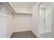 Spacious closet with built-in shelves and a shower at 2571 W 69Th Pl, Denver, CO 80221