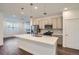 Modern kitchen with stainless steel appliances and island at 2571 W 69Th Pl, Denver, CO 80221