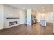 Open concept living room, kitchen, and fireplace at 2571 W 69Th Pl, Denver, CO 80221