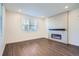 Living room with fireplace and hardwood floors at 2571 W 69Th Pl, Denver, CO 80221