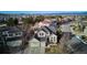 An aerial view shows the neighborhood with the property set against a backdrop of scenic mountains at 10293 Rustic Redwood Ct, Highlands Ranch, CO 80126