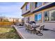 Outdoor patio offering both a cozy seating area and a dining space, ideal for entertaining guests at 10293 Rustic Redwood Ct, Highlands Ranch, CO 80126