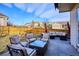 Relaxing backyard patio with comfortable seating, a fire pit, and a dining area perfect for outdoor gatherings at 10293 Rustic Redwood Ct, Highlands Ranch, CO 80126