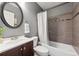 Bathroom featuring dark wood vanity, round mirror, white toilet, and shower with white curtain at 10293 Rustic Redwood Ct, Highlands Ranch, CO 80126