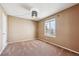Neutral-toned bedroom with large window and ample closet space at 10293 Rustic Redwood Ct, Highlands Ranch, CO 80126