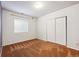 Bright bedroom with carpet, window, and large closet with white doors at 10293 Rustic Redwood Ct, Highlands Ranch, CO 80126