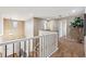 Upper landing area with railing, neutral decor, and carpeted floors at 10293 Rustic Redwood Ct, Highlands Ranch, CO 80126