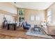 Open-concept living and dining space boasts hardwood floors and soaring ceilings, great for entertaining at 10293 Rustic Redwood Ct, Highlands Ranch, CO 80126