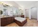 Main bath features granite counters, tiled floor, soaking tub and lots of natural light at 10293 Rustic Redwood Ct, Highlands Ranch, CO 80126